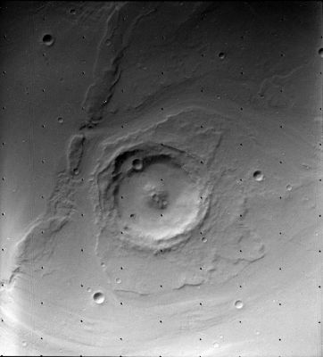 Mars: according to Viking 1 Orbiter
The results from the Viking experiments give our most complete view of Mars to date. Volcanoes, lava plains, immense canyons, cratered areas, wind-formed features and evidence of surface water are apparent in the Orbiter images. The Planet appears to be divisible into two main regions: Northern Low Plains and Southern Cratered Highlands. Superimposed on these Regions are the Tharsis and Elysium bulges - high-standing volcanic areas - and Valles Marineris, a system of giant canyons near the Equator. 
The surface material at both landing sites can best be characterized as iron-rich clay. Measured temperatures at the landing sites ranged from 150 to 250 K, with a variation over a given day of 35 to 50 K. Seasonal dust storms, pressure changes, and transport of atmospheric gases between the polar caps were observed. 
The biology experiment produced no evidence of life at either landing site.
Parole chiave: Mars from orbit