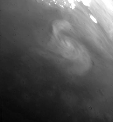 Mars, according to Viking 1 Orbiter - Martian Cyclone
This Viking 1 Orbiter image shows a "Low Pressure Cell" near the North Pole of Mars. This Cyclonic Storm is related to Mars' Polar Front, the boundary between the cold polar air and the warmer air to the south. 
These clouds are low in the Atmosphere and most likely composed of water ice. 

This image was taken in Martian Northern Mid-Summer at 6:55 MLT. The image is approx. 1150 Km across and north is at 11:30.
Parole chiave: Mars from orbit - Cyclone over Mars