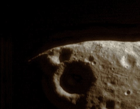 Groovy!... (natural colors; credits: Lunexit)
NEAR Shoemaker returns images that reveal not only what makes Eros distinctive, but also what it shares with other asteroids. This image, taken April 8, 2000, from an orbital height of 210 Km (about 131 miles), shows several of the linear troughs or "grooves" that mark the Asteroid's surface. 
The largest one in this image, just to the right of the shadowed crater in the lower central part of the frame, is nearly 200 meters (656 feet) across. Grooves are also found on other asteroids and small asteroid-like moons, especially the Martian moon Phobos. They are thought to form when regolith - the loose surface material thrown out of impact craters - drains into subsurface cracks. 

(Image 0130614349)
Parole chiave: Asteroids - 433-Eros