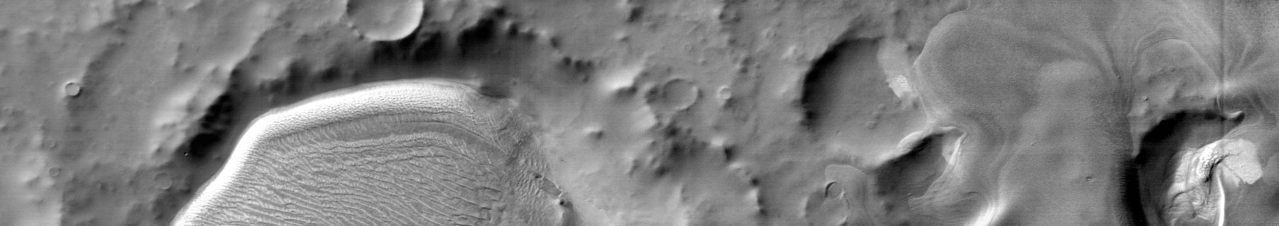 Richardson Crater (Daytime IR Light)
Caption NASA:"This Daytime IinfraRed image shows part of the dunes and deposit in Richardson Crater. The bright tone is due to the warm temperature of the dunes during the daytime".

Coord.: 72,8° South Lat. and 177,7° East Long.
Parole chiave: Mars from orbit - Craters - Richardson Crater