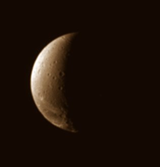 The "fractured face" of Dione
Caption NASA:"The fractured terrain so distinctive to Dione curves away toward the South in this view, which looks down at the moon's Northern Hemisphere. 
Lit terrain in this view is on the Saturn-Facing Hemisphere of Dione. 

The image was taken in visible light with the Cassini spacecraft narrow-angle camera on Nov. 22, 2006 at a distance of approx. 943.000 Km (about 586.000 miles) from Dione and at a Sun-Dione-spacecraft, or phase, angle of 109°. 
Image scale is roughly 6 Km (a little less than 4 miles) per pixel".
Parole chiave: Saturn's Moons - Dione