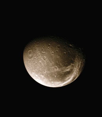 Dione (MULTISPECTRUM-2; credits: Lunexit)
Caption NASA:"The bright fractures on Dione's Trailing Side slice across terrain that is darker than the rest of the surface. Cassini scientists are working to understand the nature of the dark material that appears to coat the surfaces of several of Saturn's moons. Only after the Cassini Spacecraft began imaging Dione did they realize that the prominent "streaks" shown here are fractures on the surface. 
Lit terrain seen here is on the Saturn-Facing Side of Dione. North is up. 

The image was taken in visible light with the Cassini spacecraft narrow-angle camera on May 17, 2008. The view was acquired at a distance of approx. 873.000 Km (such as about 543.000 miles) from Dione and at a Phase Angle of 47°. 
Image scale is roughly 5 Km (a little less than 3 miles) per pixel".
Parole chiave: Saturn's Moons - Dione