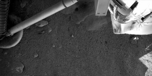 Ice under Phoenix?!? - Sol 4
Caption NASA:"This contrast-enhanced image was acquired at the Phoenix Landing Site on Sol 4 by Phoenix's Robotic Arm Camera (RAC). As seen in the top center, the exhaust from the descent engine has blown soil off to reveal either rock or ice, which has not yet been determined".
Parole chiave: Phoenix Lander and Soil