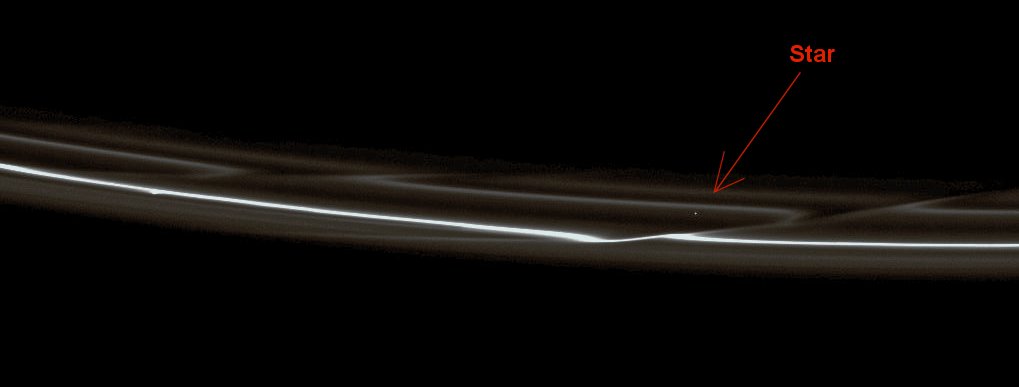 The "Fragile" F-Ring
Caption NASA:"Set starkly against the blackness of space are the F-Ring's delicate strands which are periodically gored by its shepherding moon, Prometheus. 
Prometheus (approx. 86 Km, or about 53 miles across) and Pandora (approx. 81 Km, or about  50 miles across) both interact with the F-Ring but neither is visible here. Prometheus has the larger effect (see, for instance, PIA08397 for a movie of Prometheus creating a Streamer-Channel in the ring). 
A star can be seen through the ring on the right side (Dx) of the image. 

This view looks toward the unilluminated side of the Rings from about 33° above the Ring-Plane. The image was taken in visible light with the Cassini Spacecraft narrow-angle camera on Jan. 11, 2009. 
The view was acquired at a distance of approx. 1 MKM (such as about 620,000 miles) from Saturn and at a Sun-Saturn-Spacecraft, or Phase, Angle of 37°. 
Image scale is roughly 6 Km (about 4 miles) per pixel".
Parole chiave: Saturn's Rings - The "F" Ring
