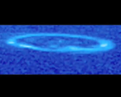 Saturnian Aurora
Caption NASA:"Glowing like a neon lasso, Saturn’s Aurora is seen spinning above Saturn’s North Pole over the course of most of a Saturn day in this image taken by the ultraviolet imaging spectrograph on NASA’s Cassini Spacecraft. 
Saturn’s auroral lights are the result of a rain of electrically charged particles from the magnetic bubble, called the Magnetosphere, that surrounds the Planet. 
When the particles strike gaseous Hydrogen in Saturn’s Atmosphere, the Hydrogen becomes excited and glows, creating Aurorae. Neon signs work in a similar way: electricity is used to excite a gas, usually Neon or Argon, in a tube. 
Changes that occur in Saturn’s Magnetosphere can cause fluctuations in the Aurora. Undulations in the Aurora may be caused by waves moving along magnetic field lines. 
A surge in auroral brightness is the result of a sudden injection of particles into the Magnetosphere. These charged particles come from a variety of sources, including the Sun, Saturn’s Rings, and the water ice plume of Saturn’s moon Enceladus. 
This image was taken on May, 25th, 2007. 
Saturn's Aurorae were discovered by NASA’s Pioneer 11 Spacecraft in 1979 and observed in the Saturn flybys by the NASA Voyager 1 and 2 Spacecrafts in the early '80s. NASA’s Hubble Space Telescope first obtained images of an Aurora in 1994. From Cassini’s always-changing orbit around Saturn, fresh observations in UltraViolet and InfraRed wavelengths are being combined with other data to help characterize similarities and differences among the Aurorae of Saturn, Jupiter and Earth". 
Parole chiave: Saturn - Upper Atmosphere - Aurora
