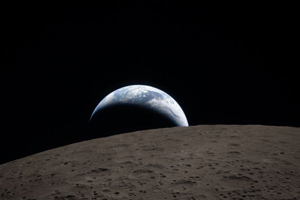 Earthset and Ohm Crater
Earthset captured through the Orion Spacecraft window during the Artemis II crew’s flyby of the Moon. 
The dark portion of the Earth is experiencing nighttime. On Earth’s day side, swirling clouds are visible over Australia and Oceania. 
In the foreground, Ohm Crater on the Moon has terraced edges and a flat Floor interrupted by Central Peaks.
Artemis II’s historic lunar flyby on Monday was one of new milestones and spaceflight records, but it was also deeply resonant with the past. After flying farther beyond the Earth than any human has ever been before—beating the record set in 1970 during Apollo 13 by about 4,102 miles—and seeing parts of the moon no humans had ever witnessed, the crew recreated “Earthrise,” one of the most famous photographs of all time, with a small twist.

Instead of Earthrise, the Artemis II photo is of Earthset, capturing the surface of the moon and the crescent-lit Earth setting beyond it in the same frame.

In 1968, a year of global political unrest, the crew of Apollo 8 was on a similar flight around the moon, on a test of a spacecraft that would be used for future lunar landings. In an unplanned moment, crew member William “Bill” Anders snapped a photo of the Earth and the moon in the same frame. The photo, called “Earthrise,” would become iconic—inspiring the global environmental movement in the years before the establishment of Earth Day in 1970.
Parole chiave: Earthset