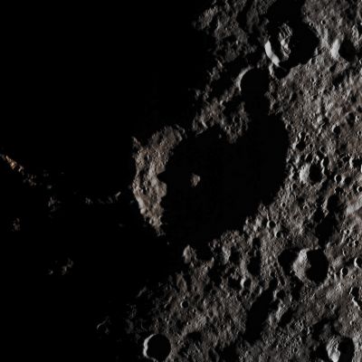 Unnamed Crater on the Terminator of 1-Ceres (Absolute Natural Colors; credits for the additional process. and color.: Dr Paolo C. Fienga/Lunar Explorer Italia/Italian Planetary Foundation)
This simply beautiful Contextual (or "CTX", for short) Frame, taken by the NASA - Dawn Spacecraft on August, 26, 2015, shows us, among other interesting things, an Ancient and extremely Complex Unnamed Impact Crater (which seems to be characterized by the presence of an unusually-looking - we would say, as IPF, "columnarly-shaped", maybe? - Central Peak) that is located near the Terminator Line of the Dwarf Planet named 1-Ceres. 

If you will pay attention to the frame, you might agree on the fact that the long shadows - which are very well visible all over the picture - make the whole scene - with its deeply complex Surface Details - even more suggestive.

The picture was taken from an altitude of approx. 915 miles (such as about 1472,5461 Km) from the Surface, with a resolution of roughly 450 feet (such as about 137,16 meters) per pixel, was taken on August 21, 2015.

This image (which is an Original NASA - Dawn Spacecraft's b/w and NON Map-Projected frame published on the NASA - Planetary Photojournal with the ID n. PIA 19898 - Dawn HAMO Image 20) has been additionally processed, extra-magnified to aid the visibility of the details, contrast enhanced and sharpened, Gamma corrected and then colorized (according to an educated guess carried out by Dr Paolo C. Fienga-LXTT-IPF) in Absolute Natural Colors (such as the colors that a normal human eye would actually perceive if someone were onboard the NASA - Dawn Spacecraft and then looked ahead, towards the Surface of 1-Ceres), by using an original technique created - and, in time, dramatically improved - by the Lunar Explorer Italia Team.
Parole chiave: Dwarf Planets - 1-Ceres