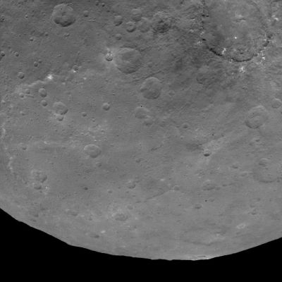 Huge Mountain on 1-Ceres (Absolute Natural Colors; credits for the additional process. and color.: Dr Paolo C. Fienga/Lunar Explorer Italia/Italian Planetary Foundation)
Located just on the Limb (obviously, only from our point of view) of the so-called "Dwarf Planet" 1-Ceres, at about 7 o'clock of 1-Ceres' (highly uneven) disk, we can see - once again - the large Flat-Topped Mountain - about 3 miles (such as approx. 4,82802 Km) high, surrounded by (relatively) smooth Terrain - that we have already shown you in yesterday's APOD. Probably it is useless to say - but it is a good thing, in our opinion, as IPF, to underline this specific circumstance - the so-called Emission Angle here is very high. The "new" White Spot, as well as the white Material that we have noticed still in yesterday's APOD, are also clearly visible here, in this picture.

As we have already said in the past, also this specific frame is just one among the first snapshots coming from Dawn's second Mapping Orbit of 1-Ceres, which is carried out from an altitude of approx. 2700 miles (such as about 4345,218 Km). Even in this case, the Resolution is roughly 1400 feet (such as approx. 426,72 meters) per pixel.

The image (which is an Original NASA - Dawn Spacecraft's b/w and NON Map-Projected frame published on the NASA - Planetary Photojournal with the ID n. PIA 19587 - Dawn Survey Orbit Image 19) has been additionally processed, magnified to aid the visibility of the details, contrast enhanced and sharpened, Gamma corrected and then colorized (according to an educated guess carried out by Dr Paolo C. Fienga-LXTT-IPF) in Absolute Natural Colors (such as the colors that a normal human eye would actually perceive if someone were onboard the NASA - Dawn Spacecraft and then looked ahead, towards the Limb and Surface of 1-Ceres), by using an original technique created - and, in time, dramatically improved - by the Lunar Explorer Italia Team.
Parole chiave: Dwarf Planets - 1-Ceres