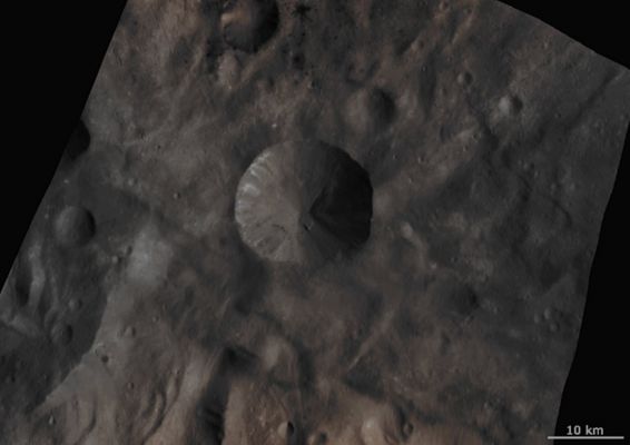 Sextilia Crater and Surroundings (Absolute Natural Colors; credits for the additonal process. and color.: Dr Paolo C. Fienga - Lunar Explorer Italia)
This Dawn FC (framing camera) image is centered on the Sextilia Crater in Vesta's Southern Hemisphere. Craters on Vesta are named after Vestal virgins, priestesses of the Roman goddess Vesta. The Sextilia Crater is a large, approximately 15 Km diameter and distinctive Crater, therefore its name was used to name the whole Quadrangle in which it is located. Sextilia Crater is distinctive because it has a fresh, sharp Rim which is also scalloped in shape. It also contains Rocky Outcrops of both bright and dark material. These originate along its Rim and sides and slump towards the center of the Crater. There are some especially large slumps of material on the right side of it. Surrounding Sextilia Crater is the Hummocky (---> wavy/undulating) Terrain of Vesta's Southern Hemisphere and some dark and bright Rayed Craters. 

This image is in Vesta's Sextilia Quadrangle and the center Latitude and Longitude of the image is 39,5° South and 155,7° East. NASA's Dawn Spacecraft obtained this image with its framing camera on October 10th 2011. This image was taken through the camera's clear filter. The distance to the surface of Vesta is approx. 702 Km and the image has a resolution of about 70 meters per pixel. This image was acquired during the HAMO (High Altitude Mapping Orbit) phase of the mission.
Parole chiave: Asteroids - 4 Vesta