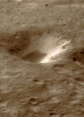 Bright Crater Wall (natural colors; credits: Lunexit)
NEAR Shoemaker captured this image on January 11, 2001, while orbiting about 38 Km (approx. 24 miles) above Eros. 
Material on the inner wall of the crater in the center of the image is brighter than the surrounding regolith and is thought to be subsurface material exposed when overlying, darker regolith slides off. 
The whole scene is about 1,2 Km (such approx. 0,7 miles) across.
Parole chiave: Asteroids - 433 Eros