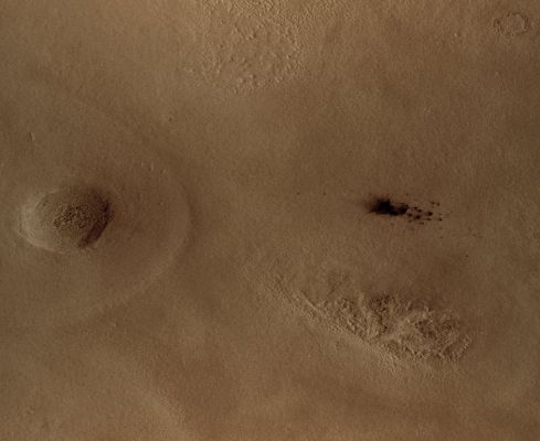 Fresh Impact in Arcadia Planitia (Natural Colors; credits: Lunexit)
The team operating the Context Camera (CTX) aboard NASA's Mars Reconnaissance Orbiter frequently discovers new dark spots on Mars that, upon closer examination, turn out to be brand new impact craters. Sometimes only a single crater is present, but often there is a cluster of several craters. 
Depending on the patterns and size, Crater Clusters are interpreted as indicating that the incoming meteorite broke apart before it hit the Surface. 
In some cases, clusters could be formed by ejecta from other, larger impact craters. 

Shown above are subframes of two Context Camera images of terrain in Western Arcadia Planitia (near 46,7° North Latitude and 183,2° West Longitude). Each covers an area about 6,5 Km (about 4 miles) across.
Parole chiave: Mars from orbit - Aracadia Planitia Region