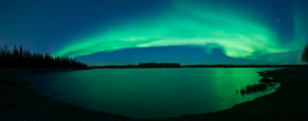 Aurora Borealis over Chena Lakes
Caption NASA:"Sometimes, after your eyes adapt to the dark, a spectacular sky appears. In this case, a picturesque lake lies in front of you, beautiful green aurora flap high above you, brilliant stars shine far in the distance, and, for a brief moment, a bright meteor streaks by. This digitally fused breathtaking panorama was captured late last month across one of the Chena Lakes in North Pole, Alaska, USA, and includes the Pleiades open cluster of stars on the image right. The shot is unusual not only for the many wonders it has captured simultaneously, but because lakes this far north tend to freeze and become non-reflecting before a sky this dark can be photographed".
Parole chiave: Aurorae