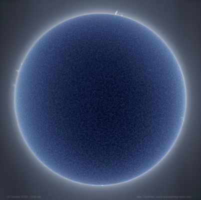 Blue Sun
Da "NASA - Picture of the Day" del giorno 4 Novembre 2009:"Our Sun may look like all soft and fluffy, but it is not. Our Sun is an extremely large ball of bubbling hot gas, mostly Hydrogen gas. The above picture of our Sun was taken last month in a specific red color of light emitted by Hydrogen gas called "Hydrogen-alpha" and then color inverted to appear blue. 
In this light, details of the Sun's Chromosphere are particularly visible, highlighting numerous thin tubes of magnetically-confined hot gas known as spicules rising from the Sun like bristles from a shag carpet. 
Our Sun glows because it is hot, but it is not on fire. Fire is the rapid acquisition of Oxygen, and there is very little Oxygen on the Sun. The energy source of our Sun is the nuclear fusion of Hydrogen into Helium deep within its core. No Sunspots or large active regions were visible on the Sun this day, although some Solar Prominences are visible around the edges".
Parole chiave: From Earth Pictures - Professional Pictures