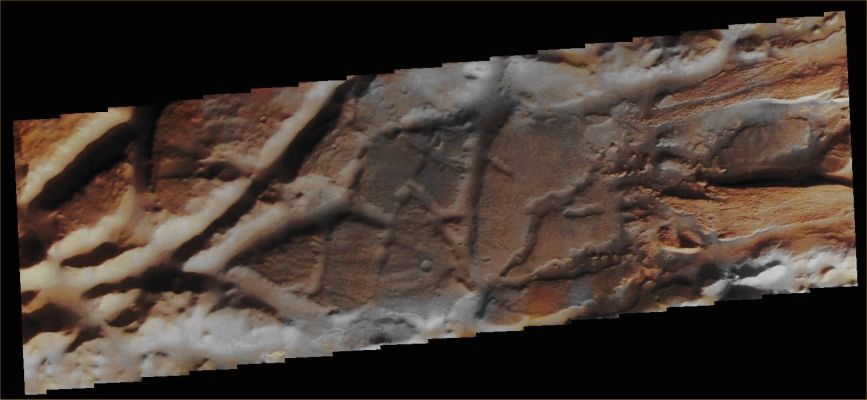 Features of Aureum Chaos (Extremely Enhanced Natural Colors; credits for the additional process. and color.: Dr Paolo C. Fienga - Lunexit Team)
Note: the THEMIS VIS camera is capable of capturing color images of the Martian Surface using 5 different color filters. In this mode of operation, the spatial resolution and coverage of the image must be reduced to accommodate the additional data volume produced from using multiple filters. To make a color image, 3 of the 5 filter images (each in grayscale) are selected. Each is contrast enhanced and then converted to a red, green, or blue intensity image. 
These 3 images are then combined to produce a full color, single image BUT, since the THEMIS color filters DO NOT span the full range of colors seen by the human eye, a color THEMIS image DOES NOT represent true color. Also, because each single-filter image is contrast enhanced before inclusion in the 3-color image, the apparent color variation of the scene is exaggerated. Nevertheless, the color variation that does appear is representative of some change in color, however subtle, in the actual scene. The long edges of THEMIS color images typically contain color artifacts that do not represent or imply actual Surface Variations. 


Image information: VIS instrument;
Latitude 3,6° South;
Longitude 332,9° East (such as 27,1° West);
Resolution: 35 meter/pixel.
Parole chiave: Mars from orbit - Chaotic Terrain - Aureum Chaos