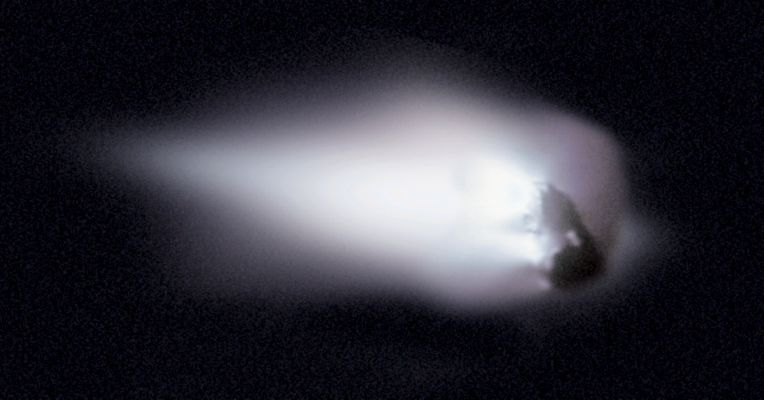 The Nucleus of Halley
What does a Comet Nucleus look like? 
Formed from the primordial stuff of the Solar System, Comet Nuclei were thought to resemble to very dirty icebergs. But ground-based telescopes revealed only the surrounding cloud of gas and dust of Active Comets nearing the Sun, clearly resolving only the Comet's Coma, and the characteristic cometary tails. 

In 1986, however, the European Spacecraft "Giotto" became one of the first group of spacecrafts which encountered and photographed the Nucleus of a Comet, when it passed and imaged Halley's Nucleus as it approached the Sun. 
Data from Giotto's camera were used to generate this enhanced image of the potato shaped Nucleus that measures roughly 15 Km across. Some Surface Features on the dark Nucleus are on the right, while gas and dust flowing into Halley's Coma are on the left. 

Every 76 years Comet Halley returns to the Inner Solar System and each time the Nucleus sheds about a 6-meter deep layer of its ice and rock into space. This debris shed from Halley's Nucleus eventually disperses into an orbiting trail responsible for the Orionids Meteor Shower, which occurs in October of every year, and the Eta Aquariids Meteor Shower, that occurs in May.
Parole chiave: Comets - Halley