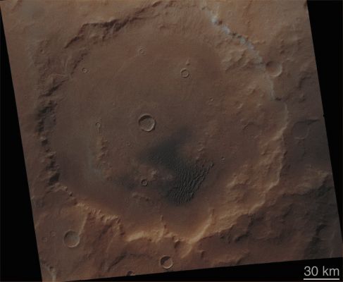 Kaiser Crater (Absolute Natural Colors; credits for the additional process. and color.: Dr Paolo C. Fienga - Lunexit Team) 
Original caption:"As the MGS Primary Mission drew to an end, the Southern Hemisphere of Mars was in the depths of Winter. At high latitudes, it is dark most - if not all - of the day. Even at middle latitudes, the Sun shines only thinly through a veil of Water and Carbon Dioxide Ice Clouds and the ground is so cold that Carbon Dioxide Frosts have formed. Kaiser Crater (located at approx. 47° South Latitude and 340° West Longitude) is one such place. At a latitude comparable to Seattle, Washington, Duluth, Minnesota, or Helena, Montana, Kaiser Crater is studied primarily because of the sand Dunefield found within the confines of its Walls (lower center of the MOC image). The normally dark-gray or blue-black sand can be seen in this image to be shaded with light-toned frost. Other parts of the Crater are also frosted (...)".

Parole chiave: Mars from orbit - Craters - Kaiser Crater