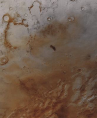 Features and Proximities of Lau Crater (CTX Frame - Absolute Natural Colors; credits for the additional process. and color.: Dr Paolo C. Fienga - Lunexit Team) 
Caption NASA:"The Martian Southern Hemisphere was nearly 2 months into its Spring Season when this picture was taken by the Mars Global Surveyor (MGS) Mars Orbiter Camera (MOC) on September 25, 1999. The scene covers a vast, Frost-coated Plain located South of the martian Antarctic Circle. The icy Terrain in the image has an almost pastel-like character, owing to the mixture of reddish Dust both on, in, and under the white Frost. The Frost - mostly frozen water at this time of year - is left over from Winter, which ended on August 2, 1999. One Martian Year is about 687 Earth days long, thus each of the Planet's 4 seasons are nearly twice as long as seasons on Earth. 
The largest Crater visible in the upper left of the frame is Lau Crater, named for the Danish Astronomer, Hans E. Lau (1879-1918). The Dark Spot near the center of the image has no name, and its origin is unknown. The picture covers an area about 1.020 Km across by approximately 1.240 Km down. 
The center is located near 76° South Lat. and 97° West Long.; North is toward the upper right. Sunlight illuminates the scene from the upper left".
Parole chiave: Mars from orbit - Craters - Lau Crater