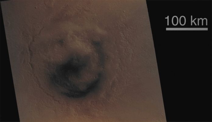 Fretted Terrain and  Lyot Crater (Absolute Natural Colors; credits for the additional process. and color.: Dr Paolo C. Fienga - Lunexit Team) 
Caption NASA:"Martian "fretted (--->corrugato/increspato) terrain" occurs in Regions of "Buttes" (--->colline "a ceppo") and "Mesas" (--->altopiani) that stand at the erosional margin where Northern low-lying Plains meet the higher-standing Cratered Uplands. Found mostly in the Mid-Northern Latitudes, some of the best examples of "Fretted Terrain" occur in the Deuteronilus Mensae Region. Here, the interaction of the process that creates the Mesas and Buttes, the processes that modify these surfaces after they form, and the relationship of both of these processes with the near-instantaneous event that formed the large Crater Lyot, provide us places to look to decipher this small but important piece of Martian Geological History.
Parole chiave: Mars from orbit - Craters - Lyot Crater