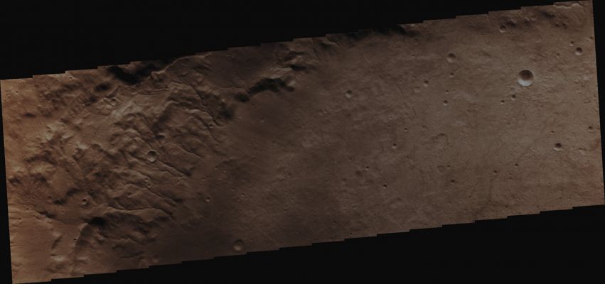 Features of Martz Crater (Absolute Natural Colors; credits for the additional process. and color.: Dr Paolo C. Fienga/Lunar Explorer Italia/Italian Planetary Foundation)
This picture, taken by the NASA - Mars Odyssey Orbiter during its 49.480th orbit around the Red Planet, shows us a small portion of the Inner Rim of the ancient Martz Crater, heavily dissected by a great number of small Channels. 
Martz Crater is located in the Southern Hemisphere of Mars, in a Region known as Terra Cimmeria; it is almost 100 Km (such as a little more than 62 miles) wide and approximately 1,5 Km (such as about 0,9 miles) deep. Martz Crater is well known among Planetary Scientists because of its very prominent and steep Complex Central Peak (which is approx. 1500 meters - or 5000 feet - tall): a Central Peak that formed, like you know, at the same time of the Crater (and as a consequence of a phenomenon known as "Rebound Effect"), right after a medium-sized Celestial Object (probably something in between 0,5 to 1 Km - such as from 0,31 to 0,62 miles - across) impacted the Surface of Mars.

Latitude (centered): 34,614° South 
Longitude (centered): 143,722° East 
Instrument: VIS 
Captured: February, 8th, 2013

This frame (which is an Original Mars Odyssey Orbiter b/w frame published on the NASA - Planetary Photojournal with the ID n. PIA 16273) has been additionally processed and then colorized in Absolute Natural Colors (such as the colors that a human eye would actually perceive if someone were onboard the NASA - Mars Odyssey Orbiter and then looked down, towards the Surface of Mars), by using an original technique created - and, in time, dramatically improved - by the Lunar Explorer Italia Team.
Parole chiave: Mars from orbit - Craters - Martz Crater
