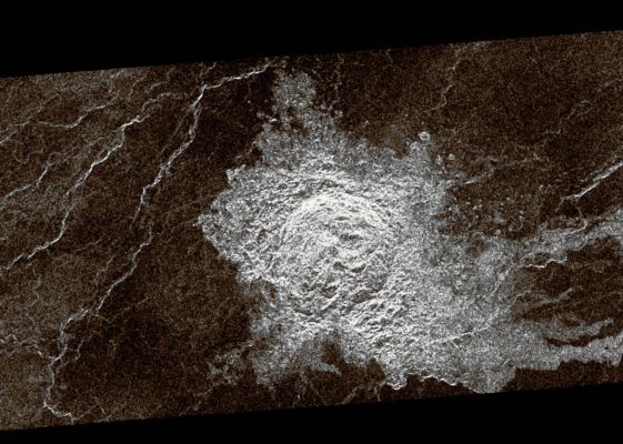 Unnamed (and heavily degraded) Crater (possible Natural Colors; credits: Dr Paolo C. Fienga - Lunexit Team)
During orbits 423 through 424 on 22 September 1990, Magellan imaged this Impact Crater that is located at Latitude 10,7° North and Longitude 340,7° East. 
This Crater is shown as a representative of Venusian Craters that are of the proper diameter (about 15 Km) to be 'transitional' in their morphology between 'complex' and irregular'. 

Complex Craters account for about 96% of all craters on Venus with diameters larger than about 15 Km; they are thought to have been formed by the impact of a large, more or less intact, mass of asteroidal material that has not been excessively effected during its passage through the dense Venusian Atmosphere. 
Complex Craters are characterized by circular Rims, terraced Inner Wall Slopes, well developed Ejecta Deposits, and flat Floors with a Central Peak or Peak Ring. 

Irregular Craters make up about 60% of the Craters with diameters less than about 15 Km. Irregular Craters are thought to form as the result of the impact of asteroidal projectiles that have been aerodynamically crushed and fragmented during their passage through the Atmosphere. 
Irregular craters are characterized by irregular and/or discontinuous Rims and hummocky or multiple Floors. 

The 'Transitional' Crater shown here has a somewhat circular Rim like larger Complex Craters, but has the hummocky Floor and asymmetric Ejecta characteristic of smaller Irregular Craters. 
Parole chiave: Venus from orbit - Craters - Unnamed Crater