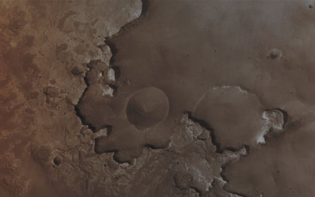Sedimentary Rocks (Absolute Natural Colors; credits for the additional process. and color.: Dr Paolo C. Fienga - Lunexit Team)
Caption NASA originale:"Burial and Exhumation of Impact Craters, and their destruction by erosion, are common and repeated themes all over the Surface of Mars. Many Craters in Western Arabia Terra exhibit light-toned, Layered Outcrops of ancient Sedimentary Rock. Like the Sedimentary Rocks explored further to the South in Meridiani Planum by the Opportunity Mars Exploration Rover (MER-B), these "Intracrater Sedimentary Rocks" may have been deposited in water. This MGS-MOC image shows an example of light-toned Sedimentary Rocks outcropping in an Unnamed Crater that is much farther North than most of the similar examples in Western Arabia Terra. This one is located near 36,6° North Lat. and 1,4° West Long. and shows several old Impact Craters in various states of erosion and exhumation from beneath and within the Sedimentary Rock Materials. The image covers an area of approx. 3 Km".  
 

Parole chiave: Mars from orbit - Craters - Unnamed Craters