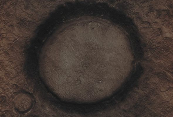 Unnamed Impact Crater wth "Black Rim" in Vastitas Borealis (Absolute Natural Colors; credits for the additional process. and color.: Dr Paolo C. Fienga - Lunexit Team)
Caption NASA originale:"This MGS-MOC image shows a nearly-filled (and very old) impact crater on the Northern Plains". 

Location near: 47,3° North Lat. and 294,0° West Long.
Image width: ~3 Km (~1,9 mi) 
Illumination from: lower left 
Season: Northern Summer 
Parole chiave: Mars from orbit - Craters - Unnamed Crater with Black Rim