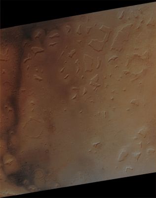 Features of Deuteronilus Mensae (Absolute Natural Colors; credits for the additional process. and color.: Dr Paolo C. Fienga - Lunexit Team) 
Caption NASA:"Subtle and not-so-subtle color variations seen in this composite of MOC images M23-01279 and M23-01280 (acquired on January 19, 2001) trace both the movement of Dark Sand of possible Volcanic origin and fresh, Dark Outcrops of unweathered Bedrock".
Parole chiave: Mars from orbit - Channels - Deuteronilus Mensae