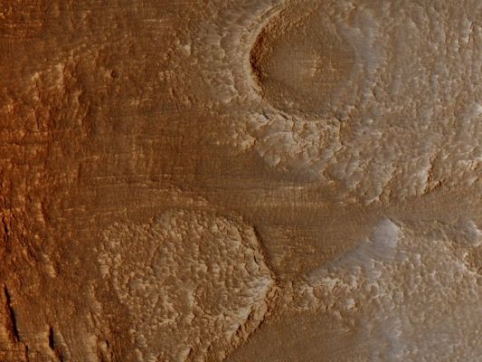 Deuteronilus Mensae (Natural Colors; credits for the add. process, and color.: Dr Paolo C. Fienga - Lunexit Team)
The Terrain in this image lies in the Deuteronilus Mensae Region, along the highland-lowland Dichotomy Boundary in the Northern Hemisphere of Mars. 

The High Resolution Imaging Science Experiment (HiRISE) camera on NASA's Mars Reconnaissance Orbiter recorded this image on March 9, 2010. 
The target for this HiRISE observation was a suggestion submitted through the camera team's HiWish public-suggestion program. For more information about how to submit target suggestions, see http://uahirise.org/hiwish/.

This Region contains many Mesas surrounded by Lobate Debris Aprons that are thought to be ice-rich. These Aprons have been interpreted as a variety of possible features including rock glaciers, ice-rich mass movements, or debris-covered glacial flows. Recent radar data from the Shallow Radar instrument on the Mars Reconnaissance Orbiter has shown them to be composed of nearly pure ice. This image shows an area at the edge of one of these Mesas with a Lobate Debris Apron extending from its base. 
Both the Mesa top and the Surface of the Debris Apron appear covered with ice-rich mantling materials characteristic of the Martian Mid-Latitudes and thought to have been deposited around 10 million years ago during a period of high obliquity. 

This image covers a swath of ground about 1 Km (about two-thirds of a mile) wide. It is a portion of HiRISE observation ESP_016959_2240, which is centered at 43,62° North Latitude and 28,62° East Longitude. The season on Mars is Northern-Hemisphere Spring. 
Parole chiave: Mars from orbit - Deuteronilus Mensae