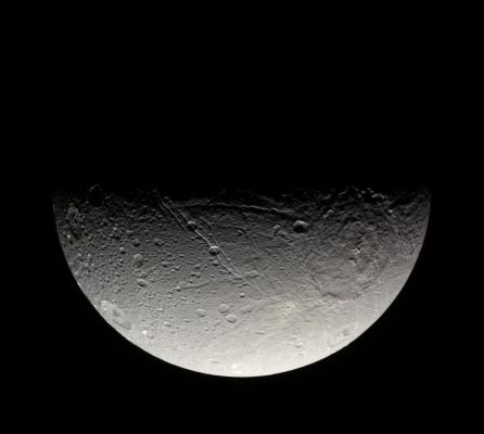 The South Polar Regions of Dione
Caption NASA:"The Cassini spacecraft takes in the crater-strewn surface near Dione's South Pole in this natural color view. Long fractures slice across the surface here, as on other parts of the moon. Previous Cassini imaging investigations have shown that the canyons seen here do not appear to have the bright, presumably youthful, walls seen in fractures nearer the Equator.

Images taken using red, green and blue spectral filters were combined to create this natural color view. The images were taken in visible light with the Cassini spacecraft narrow-angle camera on April 8, 2007 at a distance of approx. 268.000 Km (such as about 166.000 miles) from Dione and at a Sun-Dione-spacecraft, or phase, angle of 92°. 
Image scale is roughly 2 Km (5249 feet) per pixel".
Parole chiave: Saturn's Moons - Dione