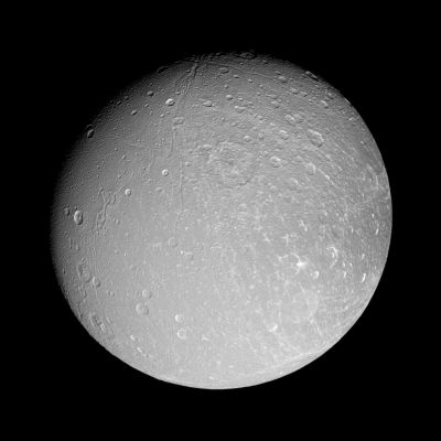 The "Face" of Dione (HR)
Caption NASA:"Canyons slink southward on Dione, while bright-walled craters gleam in the Sun. (...) This view is centered on 9° North Latitude and 51° West Longitude. 
North on Dione is up. 

The image was taken in polarized green light with the Cassini spacecraft narrow-angle camera on Sept. 30, 2007. The view was acquired at a distance of approx. 197.000 Km (such as about 122.000 miles) from Dione and at phase angle of 25°. 
Image scale is roughly 1 Km (about 0,6 mile) per pixel".
Parole chiave: Saturn's Moons - Dione