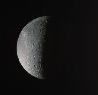 The North Polar Regions of Dione (True Colors; credits: Lunexit)
Caption NASA:"The Cassini Spacecraft looks down, almost directly at the North Pole of Dione. The feature just left of the Terminator at the bottom is Janiculum Dorsa, a long, roughly North-South trending ridge. Lit terrain seen here is on the anti-Saturn and Trailing Sides of Dione.
The image was taken with the Cassini spacecraft narrow-angle camera on March 22, 2008 using a spectral filter sensitive to wavelengths of UV light centered at 338 nanometers. The view was acquired at a distance of approx. 650.000 Km (about 404.000 miles) from Dione and at a Sun-Dione-Spacecraft angle of 99°. 
Image scale is roughly 4 Km (about 2 miles) per pixel".
Parole chiave: Saturn's Moons - Dione