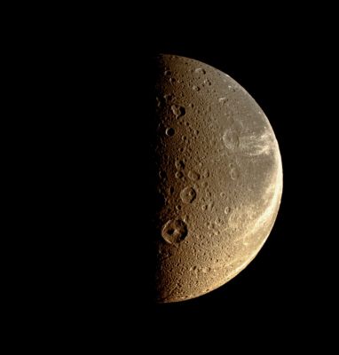 Dione (possible True Colors; credits: Lunexit)
Caption NASA:"Bright, wispy-looking fractures reach across the rugged, icy landscape of Dione (see PIA06163 for a close-up view of Dione's icy canyons). The medium-sized crater Dido, with its prominent central peak, sits just right of the Terminator, below center. 
This view looks toward the Saturn-facing Side of Dione. North is toward the top and rotated 6° to the left. 

The image was taken in visible light with the Cassini Spacecraft narrow-angle camera on July 21, 2008. The view was acquired at a distance of approx 290.000 Km (such as about 180.000 miles) from Dione and at a Sun-Dione-Spacecraft, or Phase, Angle of 89°. 
Image scale is roughly 2 Km (a little more than 1 mile) per pixel".
Parole chiave: Saturn's Moon - Dione