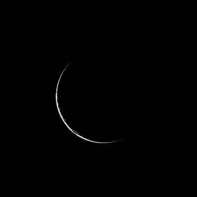 Cosmic "Smile"...
Caption NASA:"Only a sliver of Dione is visible as the Cassini Spacecraft looks at the dark side of the moon. In a high-phase viewing geometry like the one in which this picture was taken, the Sun and the Spacecraft are on nearly opposite sides of the moon. Here, only a narrow crescent reflects light forward toward Cassini's camera. The outline of a crater is just visible in the Southern Hemisphere. 

This view looks toward the Leading Hemisphere of Dione. North on Dione is up and rotated 2° to the right. The image was taken in Visible Light with the Cassini Spacecraft narrow-angle camera on Feb. 25, 2009. 
The view was acquired at a distance of approx. 484.000 Km (such as about 301.000 miles) from Dione and at a Sun-Dione-Spacecraft, or Phase, Angle of 166°. 
Image scale is roughly 3 Km (a little less than 2 miles) per pixel".
Parole chiave: Saturn's Moon - Dione