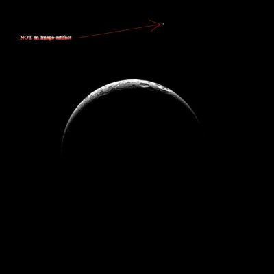A beautiful crescent Dione (with a "Small Companion", maybe...)
Caption NASA:"A thin crescent of highly Cratered Terrain is illuminated on Saturn's third largest moon, Dione. Lit Terrain seen here is on the Saturn-facing side of Dione. North is up.

The image was taken in Visible Light with the Cassini Spacecraft narrow-angle camera on May 17, 2010. 
The view was acquired at a distance of approx. 394.000 Km (about 245.000 miles) from Dione and at a Sun-Dione-Spacecraft, or Phase, Angle of 151°. 
Image scale is roughly 2 Km (about 1,2 miles) per pixel".
Parole chiave: Saturnian Moons - Dione