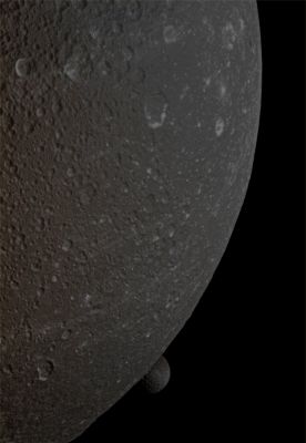 So close, and yet so far... (Absolute Natural Colors; credits for the additional process. and color.: Dr Paolo C. Fienga/Lunar Explorer Italia/Italian Planetary Foundation)
The Saturnian moon Mimas peeps out from behind the larger moon Dione in this suggestive view of a so-called "Mutual Event" as it was seen from and recorded by the NASA - Cassini Spacecraft. Mimas (which is approx. 246 miles - such as a little less than 396 Km - across) is near the bottom center of the image. This view looks toward the anti-Saturn side of Dione (which is about 698 miles - such as approx 1123,3 Km - across). North on Dione is up and rotated 20° to the right. 

The image was taken in Visible Light with the NASA - Cassini Spacecraft Narrow-Angle Camera on December 12, 2011, at a distance of approximately 377.000 miles (such as about 606.721 Km) from Mimas and approximately 56.000 miles (such as a little more than 90.000 Km) from Dione, at a Sun-Dione-Cassini Spacecraft , or Phase, Angle of 42°. Image scale is 1773 feet (such as about 540,41 meters) per pixel on Dione.

This frame (which is a crop from an Original NASA - Cassini Spacecraft b/w image published on the NASA - Planetary Photojournal with the ID n. PIA 14619) has been additionally processed and then colorized in Absolute Natural Colors (such as the colors that a human eye would actually perceive if someone were onboard the NASA - Cassini Spacecraft and then looked outside, towards the Saturnian moons Dione and Mimas), by using an original technique created - and, in time, dramatically improved - by the Lunar Explorer Italia Team. Different colors, as well as different shades of the same color, mean, among others, the existence of different Elements present on the Surface of Dione and Mimas, each having a different Albedo (---> Reflectivity) and Chemical Composition.
Parole chiave: Saturnian Moons - Dione and Mimas