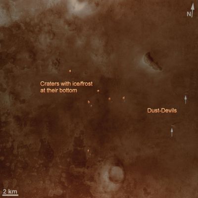 Dust Devils and Frozen Craters at Phoenix Landing Site (MULTISPECTRUM; credits: Lunexit)
NASA's Phoenix Mars Lander is scheduled to land on the Martian Northern Plains near 68° North Lat. and 127° West Long. on May 25, 2008. In preparation for the landing, NASA's Mars Reconnaissance Orbiter has been monitoring weather in the Region around the Landing Site. 
On April 20, 2008, the orbiter's Context Camera captured this view showing two active DD within the Phoenix Landing Ellipse. 

This is a subframe covering an area about 26 Km (approx. 16 miles) on each side (...). It shows two Dust Devils and their shadows. Based on measurement of the shadows cast by the DD, one of the vortices towered about 590 meters (about 1930 feet) with a dust plume extending 920 meters (about 3020 feet) above the surface. The other reached about 390 meters (1280 feet) high, with a dust plume extending to 790 meters (2590 feet). The resolution here is 6 meters (19,7 feet) per pixel. 
When the Context Camera acquired this image, the season in Mars' Northern Hemisphere was late Spring. A few weeks earlier, the Phoenix Landing Site was still covered with seasonal frost left over from the previous Winter. White patches in small craters near the center of the picture are areas where the Winter frost remained, even as late as April 20, 2008. 
As Spring gives way to Summer, DD are likely to occur more frequently, as local temperatures rise. These two DD observed in late April are among the first of the season. The cameras on the Phoenix Lander might be able to spot additional Dust Devils after the spacecraft arrives, as the Mars Exploration Rover Spirit has been able to do at its Southern Hemisphere Landing Site. 

Dust Devils are whirling vortices that have picked up dust from the ground. Such vortices can occur even when no dust is present, but then they are not visible to the cameras onboard the Mars Reconnaissance Orbiter. Such vortices commonly form as hot air rises from the surface on an otherwise generally calm day with little or no breeze. Dust Devils will travel across the surface on the gentle breezes that do occur. Sometimes, DD have been observed by cameras orbiting Mars to create streaks on the ground as they disrupt and pick up dust, though no streaks are observed in this image. 
The Mars Orbiter Camera onboard NASA's Mars Global Surveyor orbiter observed Dust Devils — and streaks created by them — throughout its 1997 to 2006 mission. During that time, scientists at Malin Space Science Systems observed more than 12.000 active Dust Devils. They were seen over the full range of elevations and nearly all latitudes on Mars. Dust Devil Streaks were found in Mars Orbiter Camera images as far North as the edge of the North Polar Residual Cap and the dune fields that surround the Region. 
However, the northernmost active DD captured by that camera was at 62,2° North Latitude, which is further South than the Phoenix Landing Site. 

Another camera on the Mars Reconnaissance Orbiter, the Mars Color Imager, captured a simultaneous, wider-field, color view of the area included in this Context Camera image. That view can be seen at PIA10634.
Parole chiave: Mars from orbit - Northern Plains