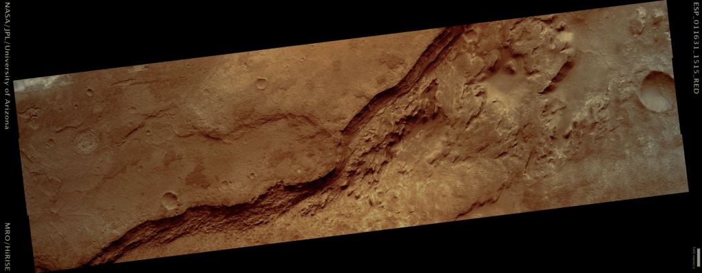 Inside Hellas Basin (Natural Colors; credits: Lunar Explorer Italia)
This image shows part of the floor of an impact crater on the Northern Rim of the giant Hellas Basin.
Hellas includes the lowest elevations on Mars, and may have once held lakes or seas; layered rock outcrops occur around much of the edge of the basin. At this site, a large impact crater (about 90 kM across) was partly filled by layered rocks. These rocks on the crater floor are now eroding and forming strange pits. 
Here, the layers are mostly exposed on a steep slope which cuts across much of the image. On this slope, they crop out as rocky stripes, some continuous and others not. The material between the stripes is mostly covered by debris, but some areas of exposed rock are visible. The slope is capped by a thick, continuous layer that armors it against erosion; once this cap is gone, the lower material is removed rapidly, forming the steep slope. At the base of this slope, rocks on the floor of the pit appear bright and heavily fragmented by cracks known as joints. The variation in rock types suggests that the rocks here were deposited by multiple processes or in different environments. Sites like this may preserve a record of conditions on early Mars.

Mars Local Time: 15:55 (middle afternoon)
Coord. (centered): 28,4° South Lat. and 57,1° East Long.
Spacecraft altitude: 256,9 Km (such as about 160,6 miles) 
Original image scale range: 25,7 cm/pixel (with 1 x 1 binning) so objects ~51,4 cm across are resolved 
Map projected scale: 25 cm/pixel
Map projection: EQUIRECTANGULAR 
Emission Angle: 0,3° 
Phase Angle: 60,1°
Solar Incidence Angle: 60° (meaning that the Sun is about 30° above the Local Horizon)
Solar Longitude: 193,8° (Northern Autumn)
Credits: NASA/JPL/University of Arizona
Additional process. and coloring: Lunar Explorer Italia
Parole chiave: Mars from orbit - Craters - Unnamed Crater with Layering