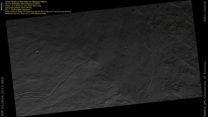 At the base of Olympus Mons... (ctx frame - Natural Colors; credits: Lunar Explorer Italia)
This image is located at the foot of the largest volcano of the Solar System: Olympus Mons.

The entire scene is covered with a multitude of Lava Flows. Most of the Flows consisted of relatively sticky lava that froze after flowing for only a short distance (often less than 1 Km, or about 1/2 a mile). However, a few of the Flows were more fluid and actually drained out of their Channels, leaving Troughs with distinct levees. These “Channelized” Flows extend out of the HiRISE image so they must be at least several kilometers (a few miles) long. 

In all likelihood, both the short and long Lava Flows have very similar chemical compositions. 
Based on experience with Lava Flows on Earth, the Channelized Flows were probably fed by more vigorous eruptions. That is, the Lava Flow was fed so quickly that the lava traveled a long distance before it solidified. With the shorter flows, a slow dribble of lava froze before going more than the equivalent of a few city blocks.
Parole chiave: Mars from orbit - Volcanoes - Olympus Mons