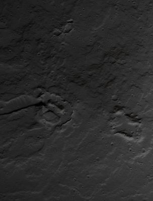 At the base of Olympus Mons... (edm - Natural Colors; credits: Lunar Explorer Italia)
The Ridge with 2 Knobs in the center of this edm is of special interest. The Lava Flows radiate away from these Knobs, indicating that the Flows were fed from these points. However, based on experience with the current eruption of Kilauea Volcano in Hawaii, it seems that these Vents were fed by a Lava Tube. 
Thus the magma first reached the Surface some distance away, then was transported through a Tube to this location. A blockage in the Tube would force the lava to burst out and erupt onto the Surface.
Parole chiave: Mars from orbit - Volcanoes - Olympus Mons
