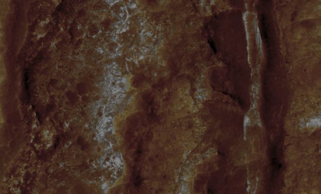 Terra Cimmeria (edm - Natural Colors; credits: Lunar Explorer Italia)
On the right side of this edm, is a valley filled with dark material and a central, bright ridge. If the valley was carved by liquid water, then this ridge may mark a former stream channel where coarse-grained sediment was deposited, which has survived erosion more effectively than the finer-grained sediment in the valley outside the channel.
Similar "Inverted Channel Deposits" are visible elsewhere on Mars, and some examples in the Southern Highlands have been inferred to contain chloride salts (similar to table salt). 
The color and texture of the possible Inverted Channels in this image are similar to those inferred to contain chlorides, which may have been deposited when salty water evaporated. 
Considered together, the features in this image attest to a history of water-related activity at this location on Mars.
Parole chiave: Mars from orbit - Terra Cimmeria