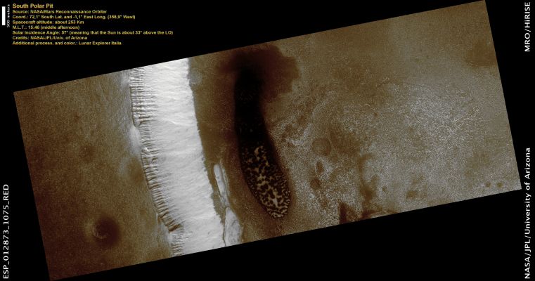 Polar Pit (Natural Colors; credits: Lunar Explorer Italia)
This image features the North Wall and Floor of a Polar Pit in the Southern Hemisphere. The Pit Wall is sculpted into a row of gullies. Gullies typically have a triangular start upslope, followed by a channel that transported material, and a triangular debris fan downslope. 

Polar Pit Gullies might be related to seasonal changes in frost coverage, but their exact origin is currently unknown. The Gullies appear bright because they probably have seasonal frost on them. The Pit Floor contains a field of dark Sand Dunes. 
Wind has transported sand across the Martian Surface, and it was deposited in this Pit and formed dunes. 
Some of the sand in the Dunes might have come from the gully debris fans or other erosion of the Pit wall. The bright material within the dunes and along the floor is seasonal frost that is probably composed of CO2 and water ice.
Parole chiave: Mars from orbit - South Polar Regions - Pit