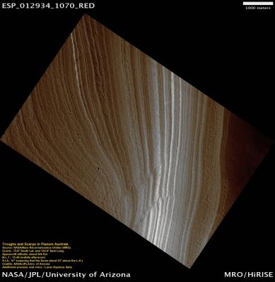 Troughs and Scarps in Planum Australe (Natural Colors; credits: Lunar Explorer Italia)
This image shows an outcrop of the South Polar Layered Deposits (SPLD). The SPLD consist of layers of ice and admixed dust and make up the bulk of the dome-shaped Planum Australe.
Planum Australe is, in some ways, analogous to the Antarctic ice sheet. Troughs and scarps carved into Planum Australe by erosional processes have exposed SPLD layers within it. 
In this image, the darkest area at the bottom of the image is the bottom of the Scarp. Except for the dark material at the bottom of the slope, much of the changes in brightness in this image are due to the lighting angle, such as the direction from which the Sun is illuminating the slope. 

Much like ice cores from Greenland and Antarctica and deep sea sediment cores, the icy-dusty layers of the SPLD may have preserved a record of recent Mars Climate History. Understanding that record is a complex process and involves, among many other types of analyses, examining the differences and similarities in appearance between each layer and attempting to classify layer types. This image shows nice examples of different layer textures. But what is especially interesting about this image are the Faults cutting through the Layers. These Faults appear as diagonal lines, on either side of which, the layering is offset. 
Note that the Faults are not clean, single lines, but appear in long groups of short lines. What caused these Faults is still under investigation, but, among other possibilities, they could be related to an earlier time when temperatures were higher and the ice was flowing at a much faster rate than it is today.
Parole chiave: Mars from orbit - South Polar Regions - SPLD