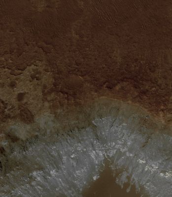 The Floor of Eos Chasma (edm - Natural Colors; credits: Lunar Explorer Italia)
An Eroded Crater exposes compositional differences below the Surface: the bluish tones are probably fresher, boulder-rich exposures of Basalt and the lighter-toned material near the base of the crater wall may have a different composition. 
The bottom of the crater is filled with material that is similarly-toned to the Surface of Eos Chasma, and was likely eroded and transported there by the wind.
Parole chiave: Mars from orbit - Eos Chasma