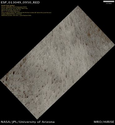 South Polar Spiders (Natural Colors; credits: Lunar Explorer Italia)
This image is part of an ongoing seasonal monitoring effort in this location in the Southern Polar Region of Mars.

Mars’ South Polar Region changes significantly during the Martian Year. During the Southern Hemisphere’s Winter, the Polar Cap increases dramatically as the lowered temperatures make a large portion of the Atmosphere freeze out into ice. 
As Spring approaches and the Polar Region begins to warm once again, the Cap recedes revealing terrains like those visible in this image. The polygonal features in this image are termed “Spiders” and their origin is still unknown (although there are several hypotheses). 

One possible hypothesis for the black fan-shaped features is that they may be formed by a geyser-like process. As the Sun heats the ground layer below the Carbon Dioxide ice, the ice on the bottom begins to sublimate, or turn directly from a solid to a gas. 
This gas then builds up in pressure as more of it sublimates, until a critical pressure is achieved and it erupts through the ice layer much as a geyser would, spewing the debris that is thought to make up the dark fan shaped features.
Parole chiave: Mars from orbit - South Polar Regions - Spiders