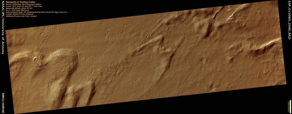 Tooting Crater (Natural Colors; credits: Lunar Explorer Italia)
This image is of the Ejecta Blanket of the Tooting Crater in the Northern Hemisphere of Mars.
Tooting is a "rampart" crater that is roughly 29 Km (about 18 miles) in diameter and appears to be one of the youngest craters of this size. 
A "rampart crater" is one where the material ejected from the crater during impact forms lobes that end with a low ridge, or rampart. One indication of Tooting Crater's youth is its ratio of depth to width. 
As a crater ages, the walls of the crater will tend to erode and debris will accumulate in the crater's floor making its apparent depth less, while also making its width larger.

One of the major features of Tooting Crater are its multiple ejecta layers that build a sequence of ramparts. The shapes of these ramparts suggest that the ejected material acted as a fluid (like mud) as it moved across the surface. 
Most researchers think that such fluid ejecta indicates that there was ice in the ground when the crater formed.
Parole chiave: Mars from orbit - Craters - Tooting Crater
