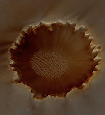Victoria Crater (EDM - Natural Colors; credits: Lunexit)
Victoria Crater was explored by Opportunity Rover for more than a Mars year; HiRISE images have supported surface exploration and contributed to joint scientific studies.

HiRISE stereo data were used to measure slopes and help select safe paths for the intrepid Rover. The most interesting exposures of geologic strata are in the steep walls of the Crater, difficult to image from the overhead perspective of orbiting spacecraft like MRO. However, MRO can point to the sides, and did so in this case to get a better view of layers in the West-facing and sunlit slopes of the Crater.

Especially prominent is a bright band near the top of the Crater Wall, interpreted by some MER scientists as having formed by diagenesis (chemical and physical changes in sediments after deposition). This bright band separates the bedrock from the impact ejecta deposits of Victoria Crater.
Parole chiave: Mars from orbit - Craters - Victoria Crater