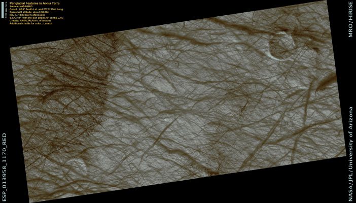 DD Tracks in Aonia Terra (Natural Colors; credits: Lunexit)
Throughout this entire image in Aonia Terra, it is possible to make out regular polygonally shaped patterns. Here on Earth, wherever ice-rich permafrost occurs (soil which stays frozen throughout the year), the ground may crack and form similar patterns to those we see on Mars.

Despite remaining below freezing, changes in seasons and ground temperature cause significant thermal-contraction stress, enough so that the terrain fractures into a honeycomb network of subsurface cracks.
Criss-crossed dark paths wind throughout this Region. Dust Devils, turbulent whirlwinds fueled by rising ground-warmed Atmosphere, track across the Surface, stripping the ground of bright surface dust as they go. Comparable to miniature tornadoes, they efficiently transport Surface Materials on Mars. Left in their passing is the darker coarse-grained soil underneath.

In this image, the Sun is low on the horizon; the shadows make it easier to see the scattered rocks and boulders. 
Sometimes, these boulders occur in rings, the remnants of an ancient impact whose crater has since eroded to a flat surface. The boulders are left behind, illustrating where the form of the crater once stood.
Parole chiave: Mars from orbit - DD Tracks - Aonia Terra