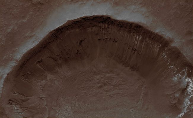 Unnamed Crater in Terra Cimmeria (Natural Colors; credits for the additional process. and color.: Dr Paolo C. Fienga - Lunexit Team)
Mars Local Time: 14:18 (early afternoon)
Coord. (centered): 38,6° South Lat. and 168,8° East Long.
Spacecraft altitude: 267,7 Km (such as about 167,3 miles) 
Original image scale range: 53,6 cm/pixel (with 2 x 2 binning) so objects ~ 1 mt and 61 cm across are resolved
Map projected scale: 50 cm/pixel
Map projection: EQUIRECTANGULAR
Emission Angle: 19,6° 
Phase Angle: 54,8°
Solar Incidence Angle: 37° (meaning that the Sun is about 53° above the Local Horizon)
Solar Longitude: 316,2° (Northern Winter)
Credits: NASA/JPL/University of Arizona
Additional process. and coloring: Lunar Explorer Italia
Parole chiave: Mars from orbit - Craters - Unnamed Crater - Terra Cimmeria