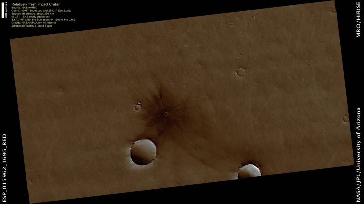 Relatively fresh Impact Crater (CTX Frame - Natural Colors; credits: Dr Paolo C. Fienga - Lunexit Team)
This image shows a very fresh-looking Impact Crater with an extensive Radial Ejecta Blanket.
The Crater was first seen in an image acquired with MRO's Context Camera (CTX). The best image of this Region prior to CTX was from one of the Viking Orbiters, and the Crater is not visible in it. 
This could either mean that the Crater formed sometime between 1976 and 1999, or that there might have been more Dust on the Surface in 1976, or that maybe the air could have been hazy, thus obscuring the Crater.

Based on the HiRISE image, we suspect that the Crater is more than several decades old, because at full resolution we see a "Textured Surface" (see EDM n.2) that is common in Dust-Mantled Regions of Mars, but absent in the youngest craters.
Parole chiave: Mars from orbit - Craters - Fresh Crater