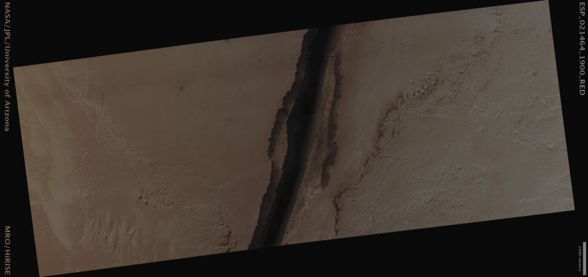 Fissure in Cerberus Fossae (CTX Frame - Absolute Natural Colors; credits for the additional process. and color.: Dr Paolo C. Fienga - Lunar Explorer Italia)
Mars Local Time: 15:05 (Early Afternoon)
Coord. (centered): 10,1° North Lat. and 157,6° East Long.
Spacecraft altitude: 295,6 Km (such as about 184,7 miles) 
Original image scale range: 29,6 cm/pixel (with 1 x 1 binning) so objects ~89 cm across are resolved 
Map projected scale: 25 cm/pixel
Map projection: EQUIRECTANGULAR 
Emission Angle: 21,2° 
Sun-Mars-Spacecraft (or "Phase") Angle: 74,9°
Solar Incidence Angle: 56° (meaning that the Sun is about 34° above the Local Horizon)
Solar Longitude: 242,5° (Northern Fall)
Credits: NASA/JPL/University of Arizona
Additional process. and coloring: Dr Paolo C. Fienga - Lunar Explorer Italia
Parole chiave: Mars from orbit - Volcanic Features - Fissures - Cerberus Fossae